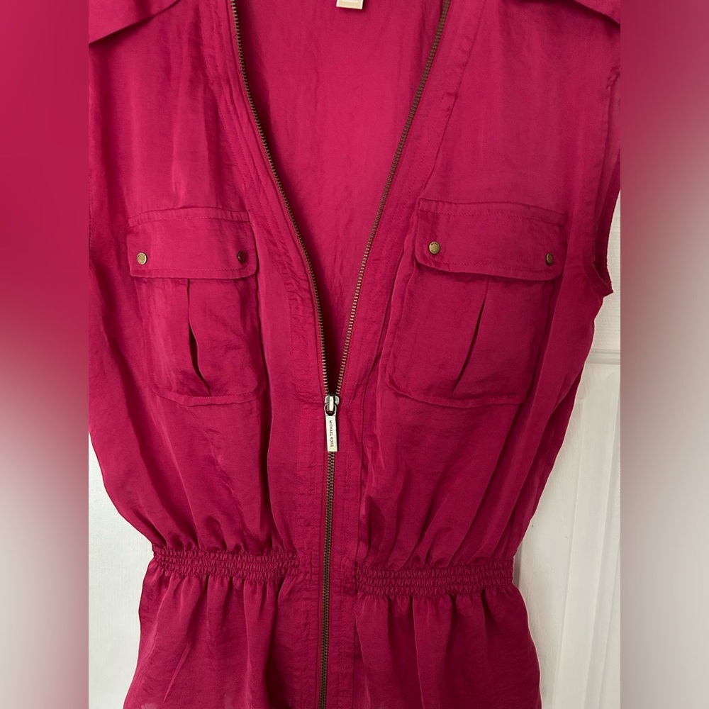 Pink silk zippered safari vest.